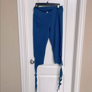 Free People Movement leggings with ties on the bottom. Size medium
